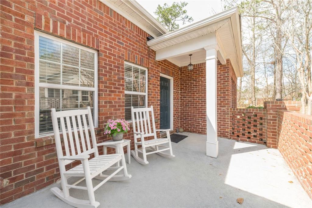 347 Villa Park Circle Stone Mountain, GA 30087 - Photo 2 of 25 a balcony with chairs and with wooden fence