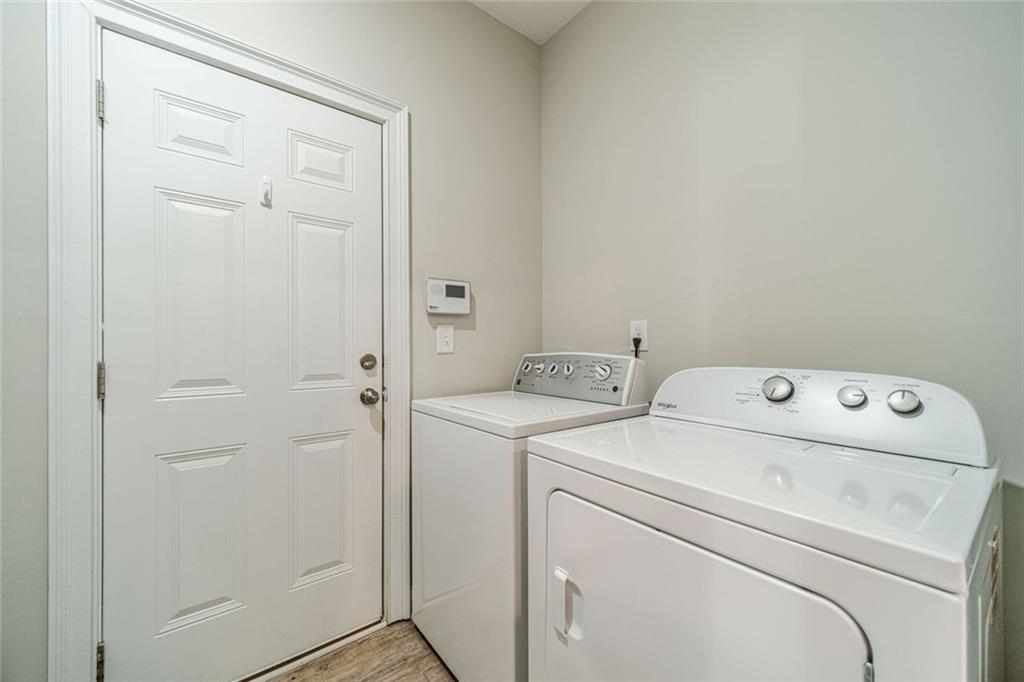 347 Villa Park Circle Stone Mountain, GA 30087 - Photo 22 of 25 a utility room with dryer and washer