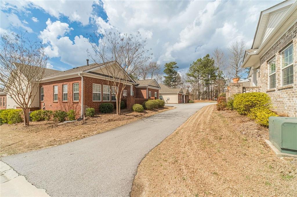 347 Villa Park Circle Stone Mountain, GA 30087 - Photo 24 of 25 a front view of a house with a yard and garage