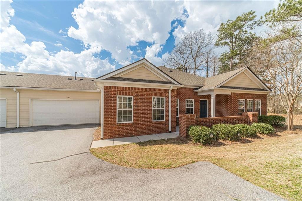 347 Villa Park Circle Stone Mountain, GA 30087 - Photo 25 of 25 a front view of a house with a yard and garage