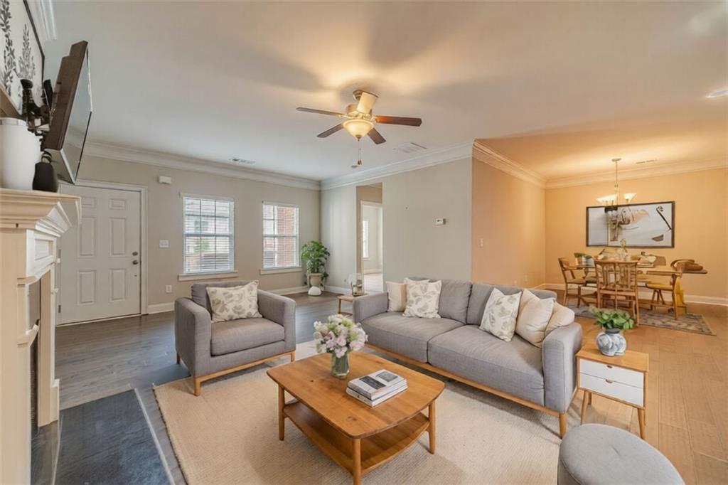 347 Villa Park Circle Stone Mountain, GA 30087 - Photo 3 of 25 a living room with furniture a fireplace and a flat screen tv