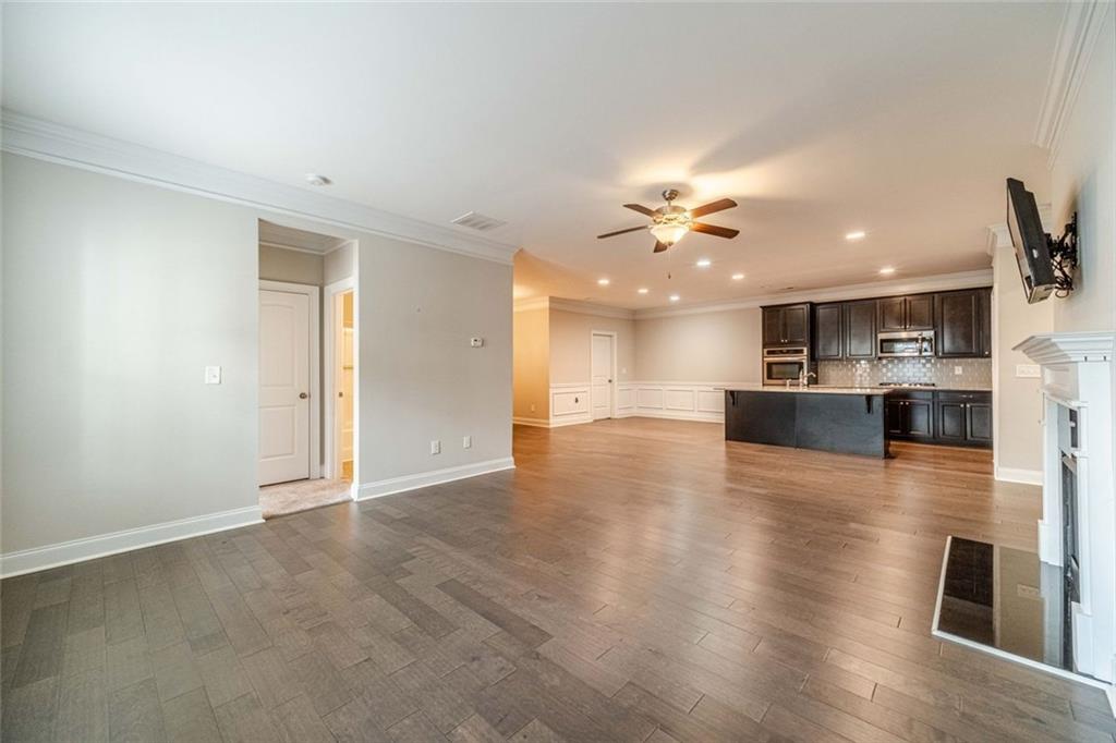 347 Villa Park Circle Stone Mountain, GA 30087 - Photo 5 of 25 a view of kitchen and hall with wooden floor