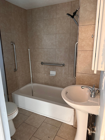 154 East Harris Street Ogden, UT 84401 - Photo 5 of 10 Bathroom featuring tile patterned floors and shower / bathtub combination