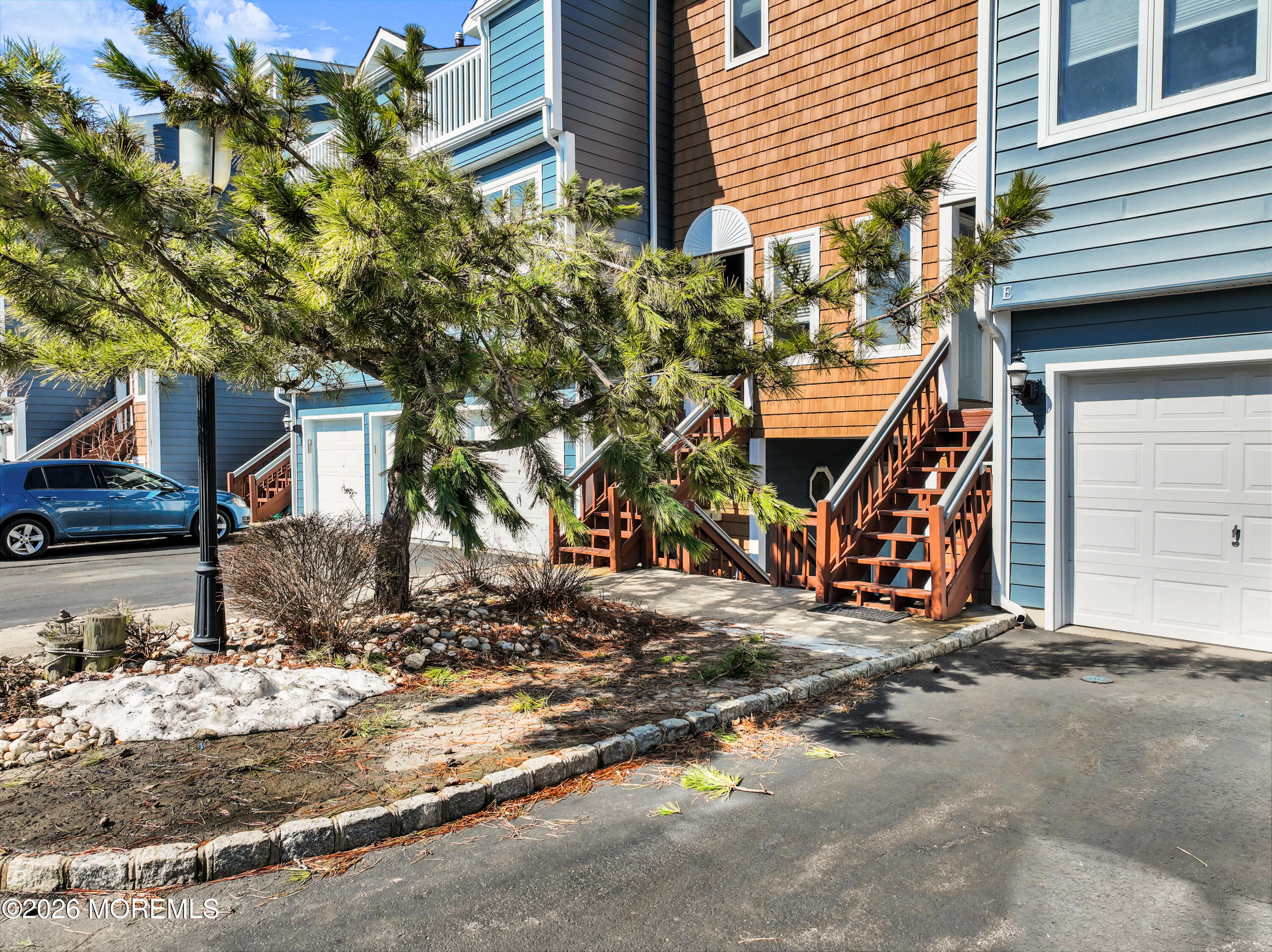 135 1st Street, Unit 1E Keyport, NJ 07735 - Photo 11 of 40 a view of a house with a tree