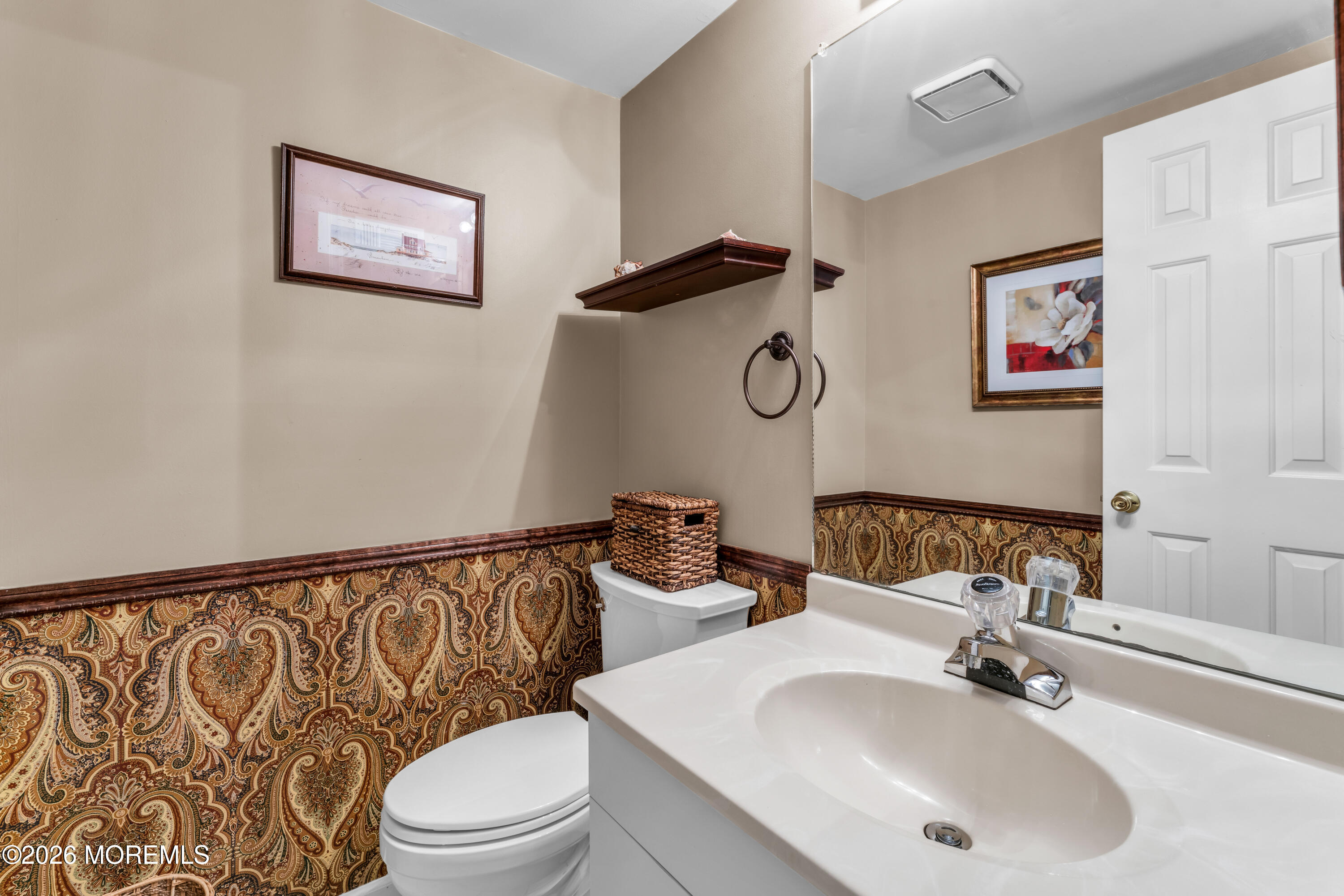 135 1st Street, Unit 1E Keyport, NJ 07735 - Photo 13 of 40 a bathroom with a sink mirror vanity and toilet