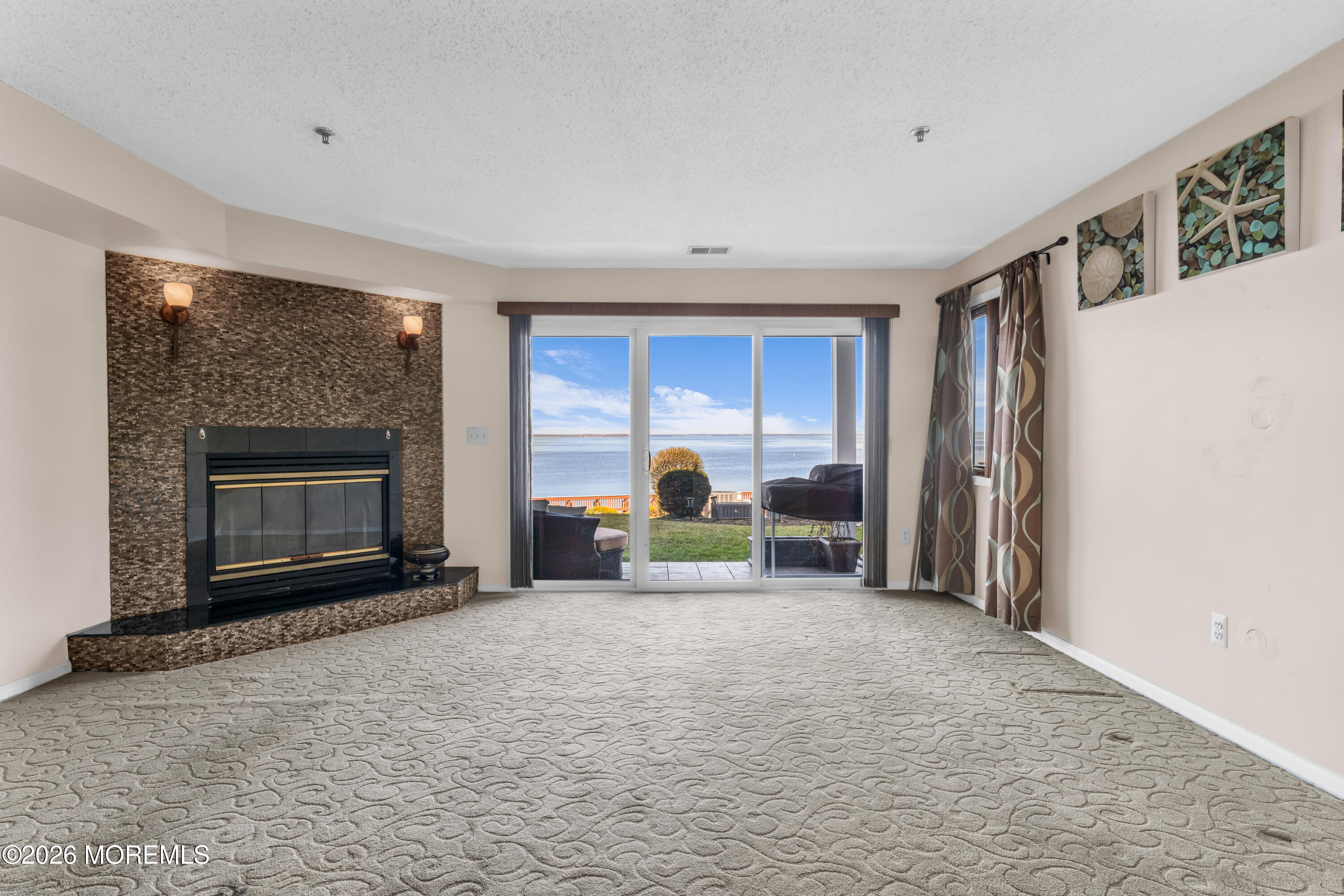 135 1st Street, Unit 1E Keyport, NJ 07735 - Photo 14 of 40 a view of a livingroom with a fireplace and workspace