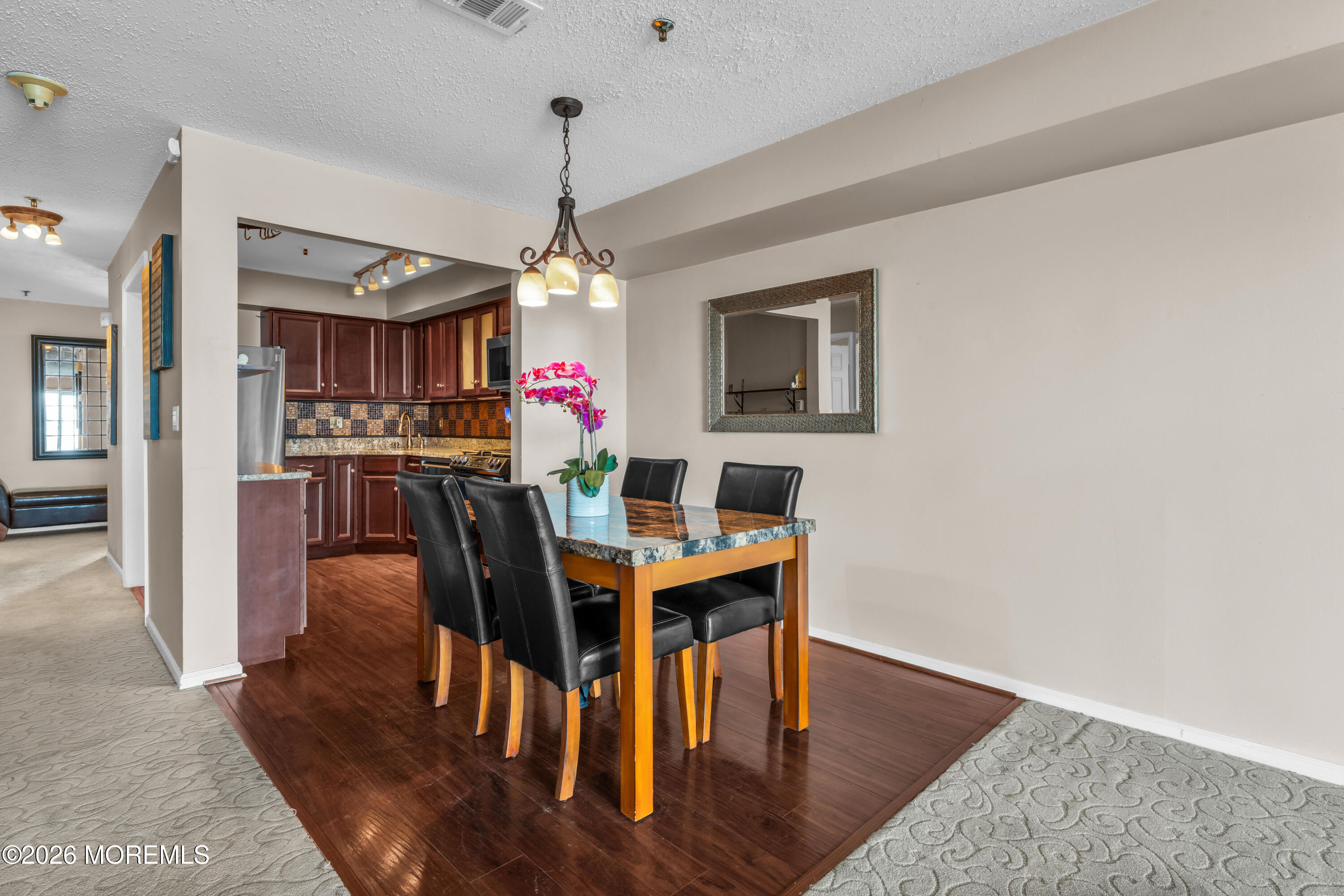 135 1st Street, Unit 1E Keyport, NJ 07735 - Photo 19 of 40 a view of a dining room with furniture window and wooden floor