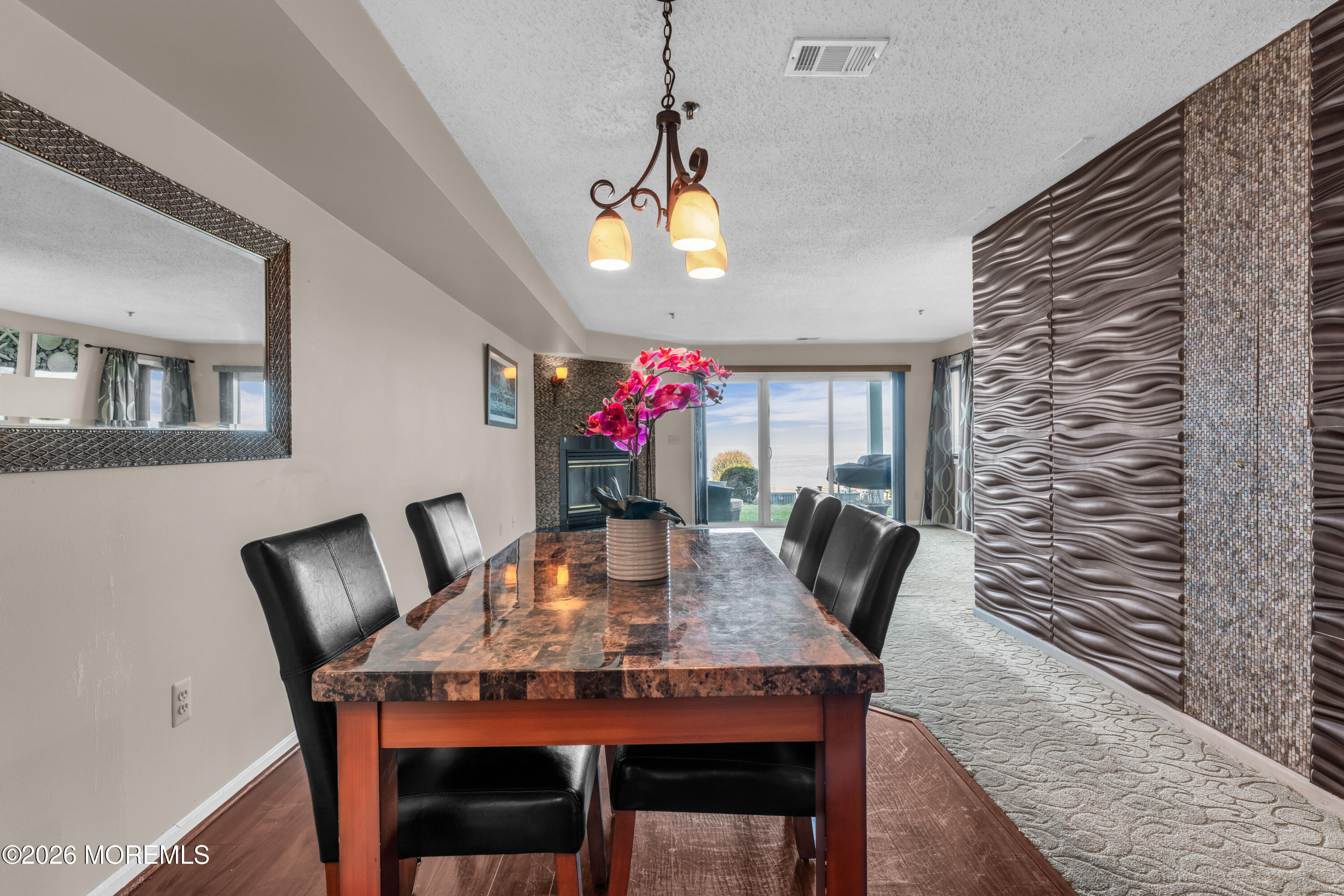 135 1st Street, Unit 1E Keyport, NJ 07735 - Photo 20 of 40 a view of a dining room with furniture and chandelier