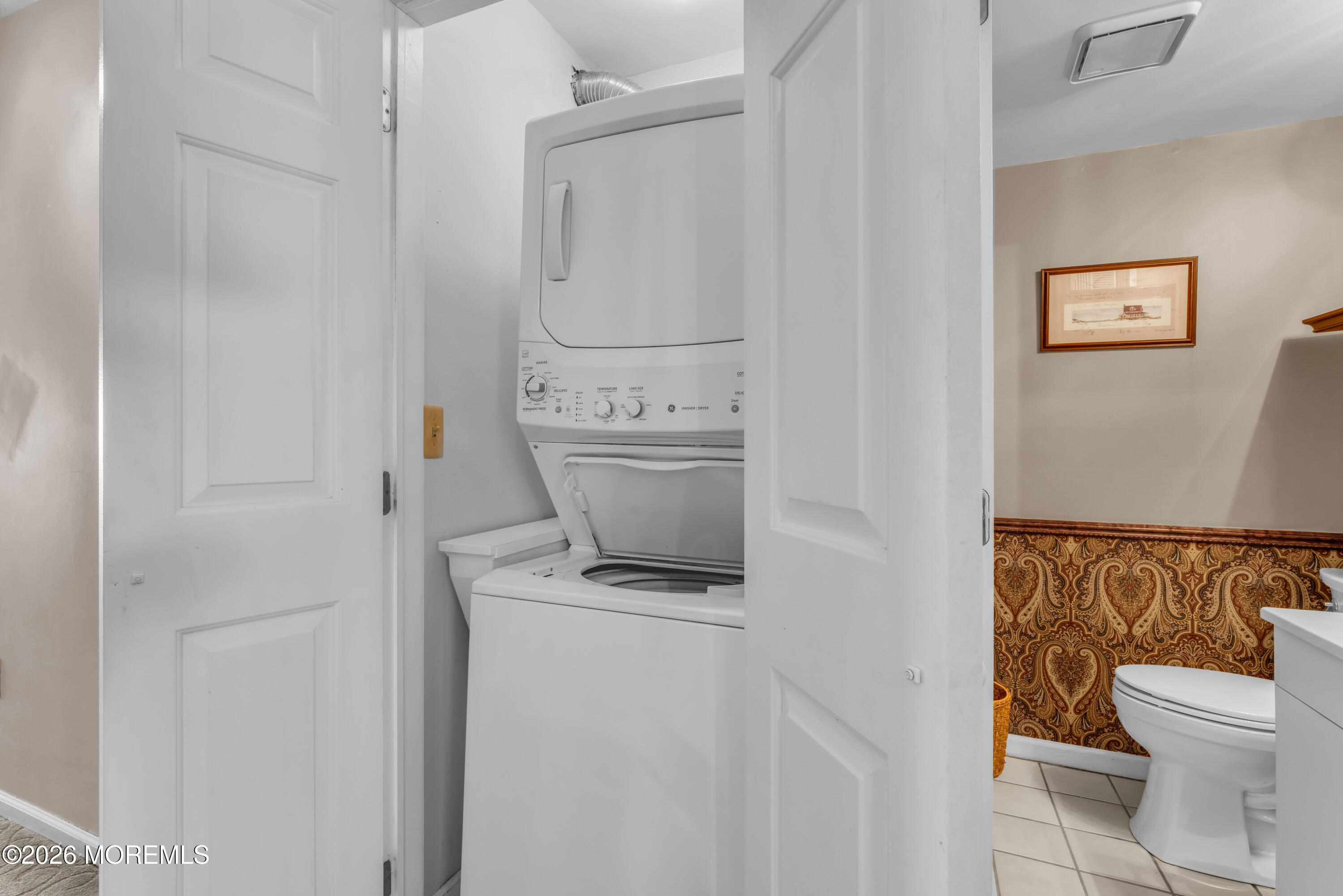 135 1st Street, Unit 1E Keyport, NJ 07735 - Photo 24 of 40 a bathroom with a granite countertop sink a toilet and a shower