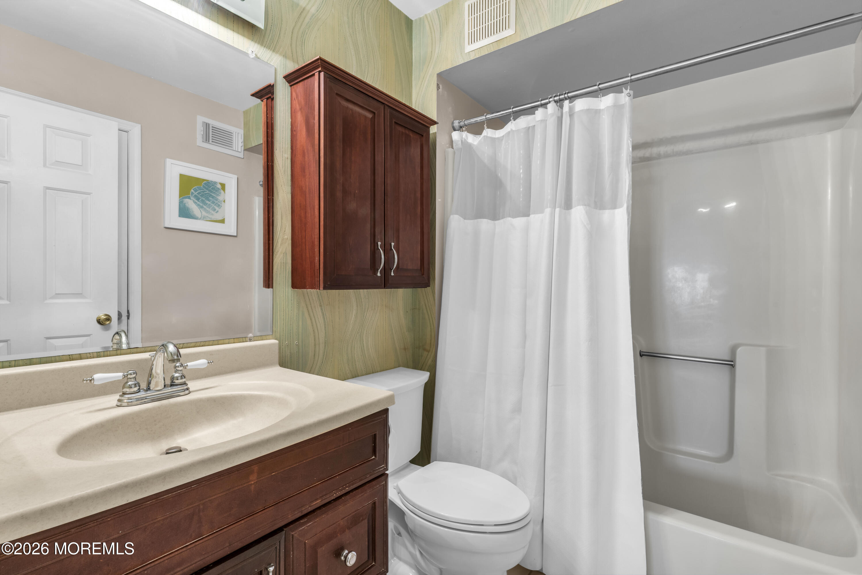 135 1st Street, Unit 1E Keyport, NJ 07735 - Photo 29 of 40 a bathroom with a sink toilet and shower