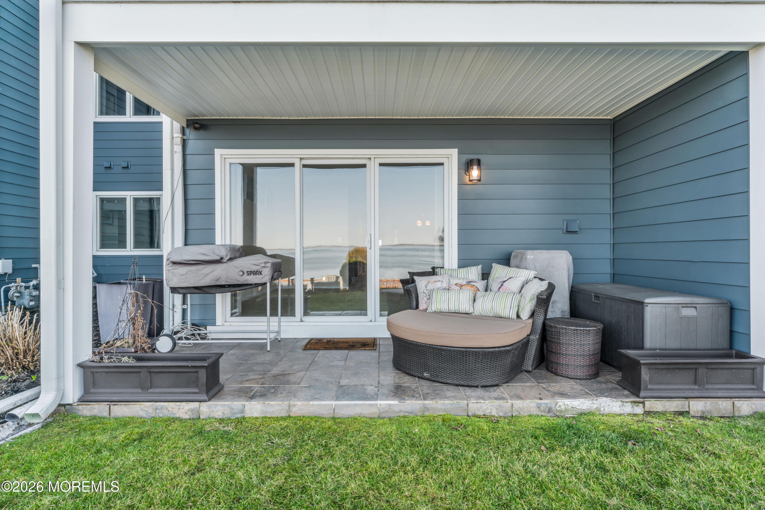 135 1st Street, Unit 1E Keyport, NJ 07735 - Photo 30 of 40 a patio with couches and a fire pit