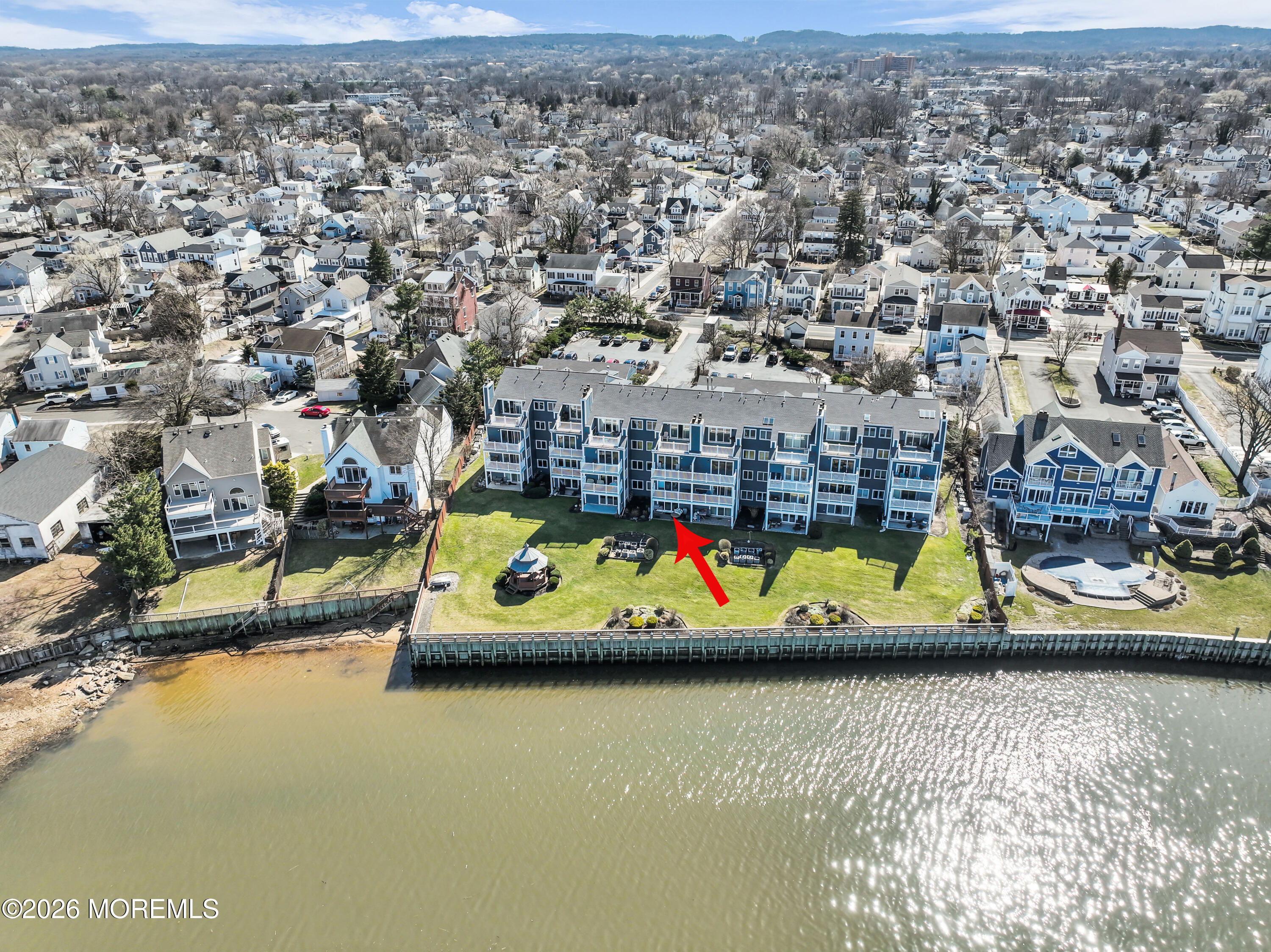 135 1st Street, Unit 1E Keyport, NJ 07735 - Photo 3 of 40 an aerial view of residential houses with outdoor space