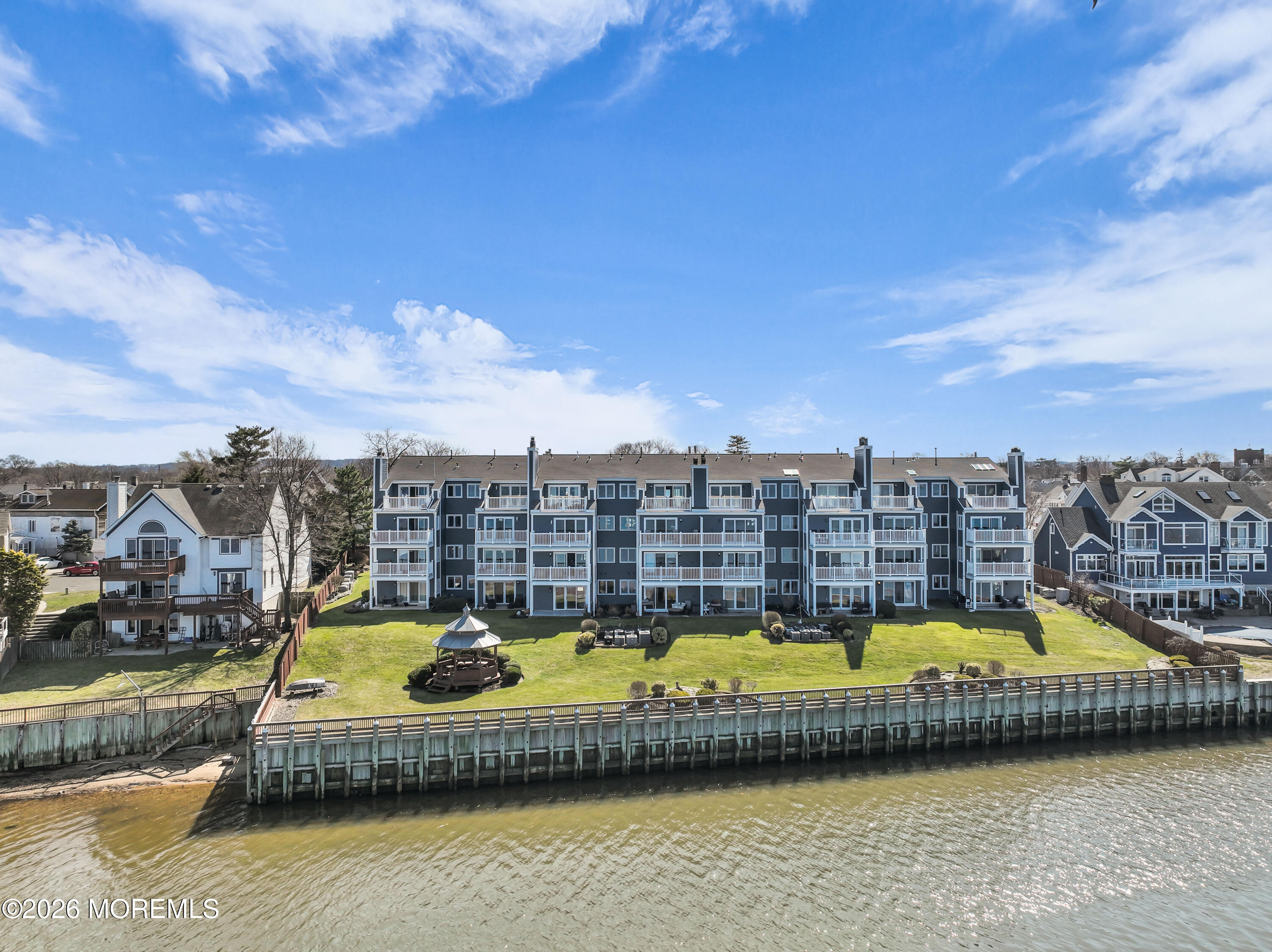 135 1st Street, Unit 1E Keyport, NJ 07735 - Photo 34 of 40 a view of a swimming pool with a lounge chair
