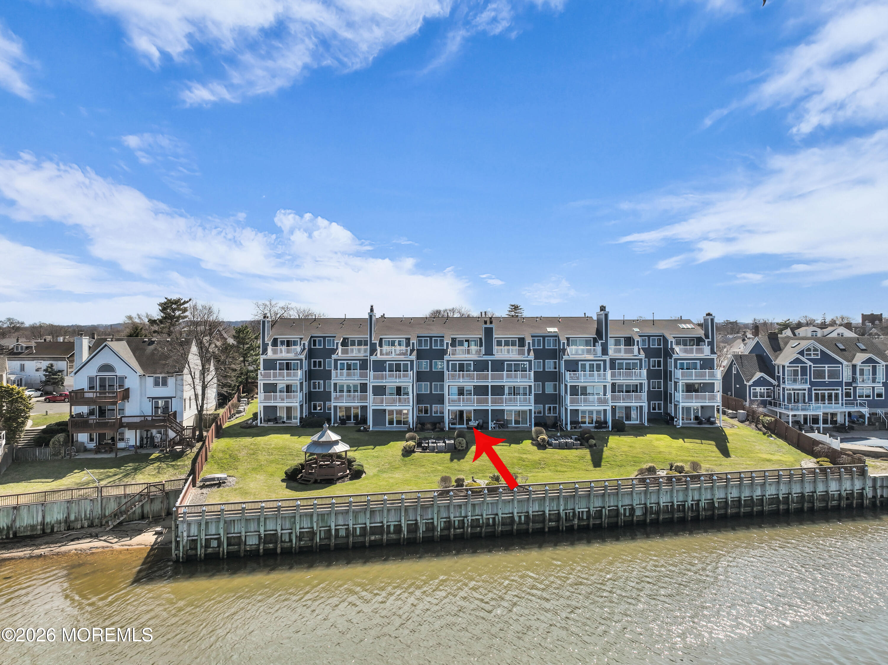 135 1st Street, Unit 1E Keyport, NJ 07735 - Photo 4 of 40 a view of a swimming pool with a lounge chair