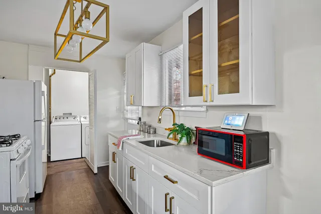 a bathroom with sink and mirror
