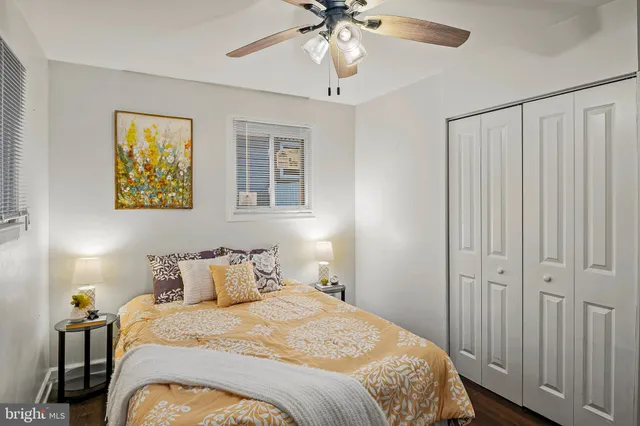 a bathroom with a sink mirror vanity and toilet