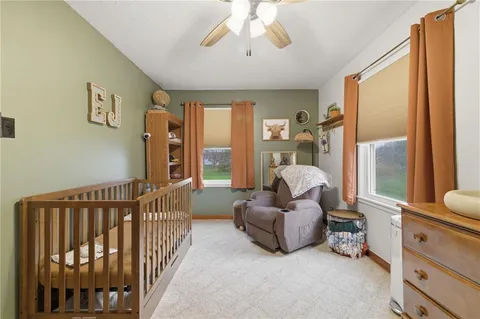 a bed room with furniture and a window