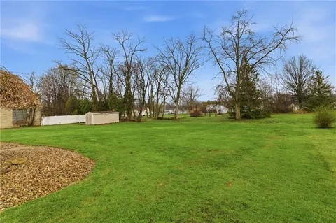 a view of a house with a big yard