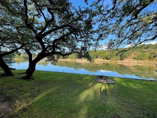 602 Sycamore Road Burnet, TX 78611 - Photo 5 of 26 a backyard of a house with lots of green space