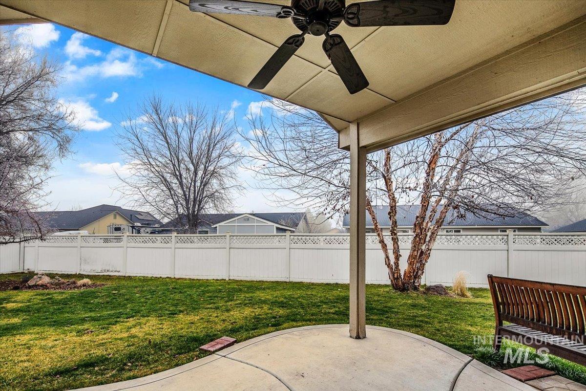 1513 Fairway Street Middleton, ID 83644 - Photo 14 of 20 Fenced backyard featuring a patio area and a ceiling fan