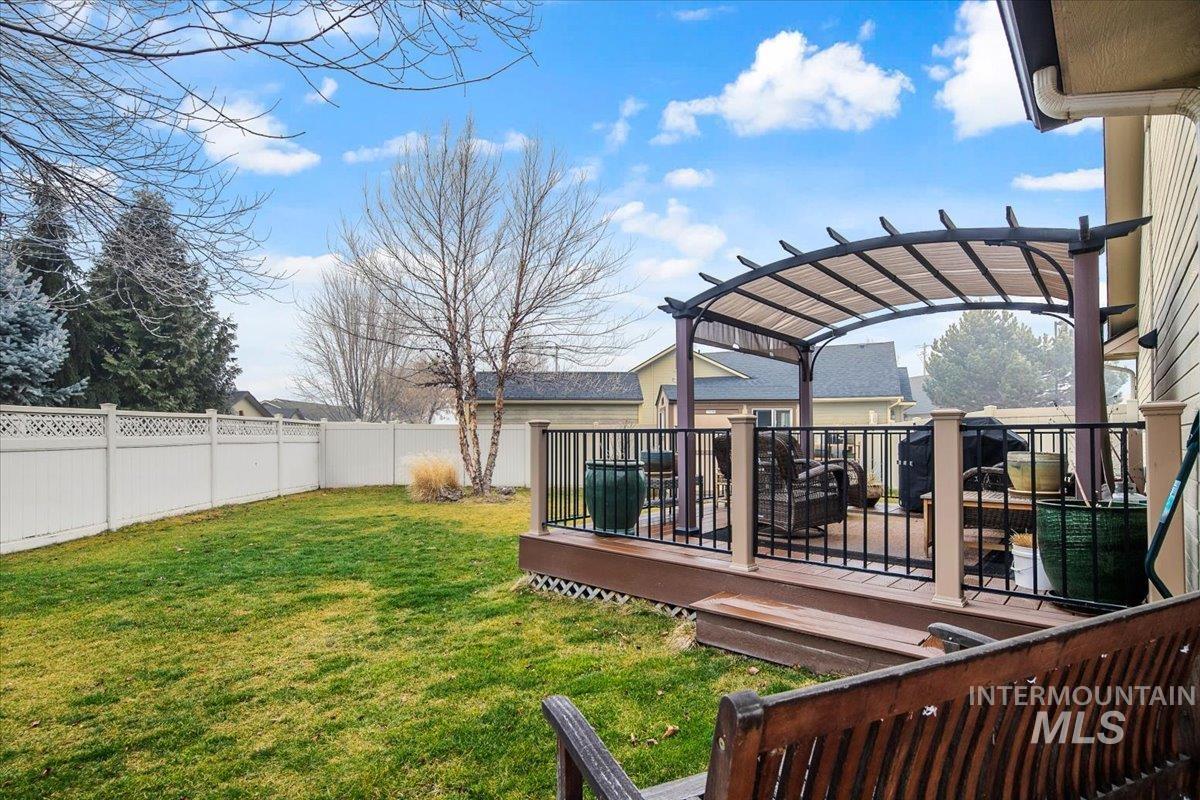 1513 Fairway Street Middleton, ID 83644 - Photo 15 of 20 Fenced backyard with a wooden deck and a pergola