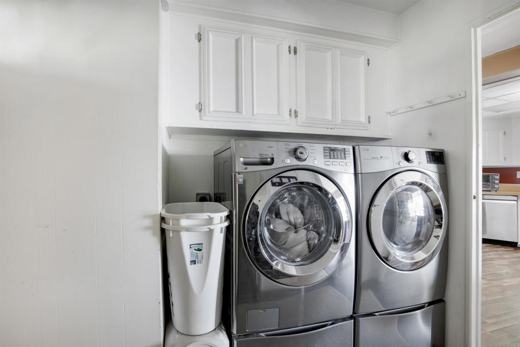 18218 Paradise Mountain Road Valley Center, CA 92082 - Photo 22 of 53 a utility room with dryer and washer