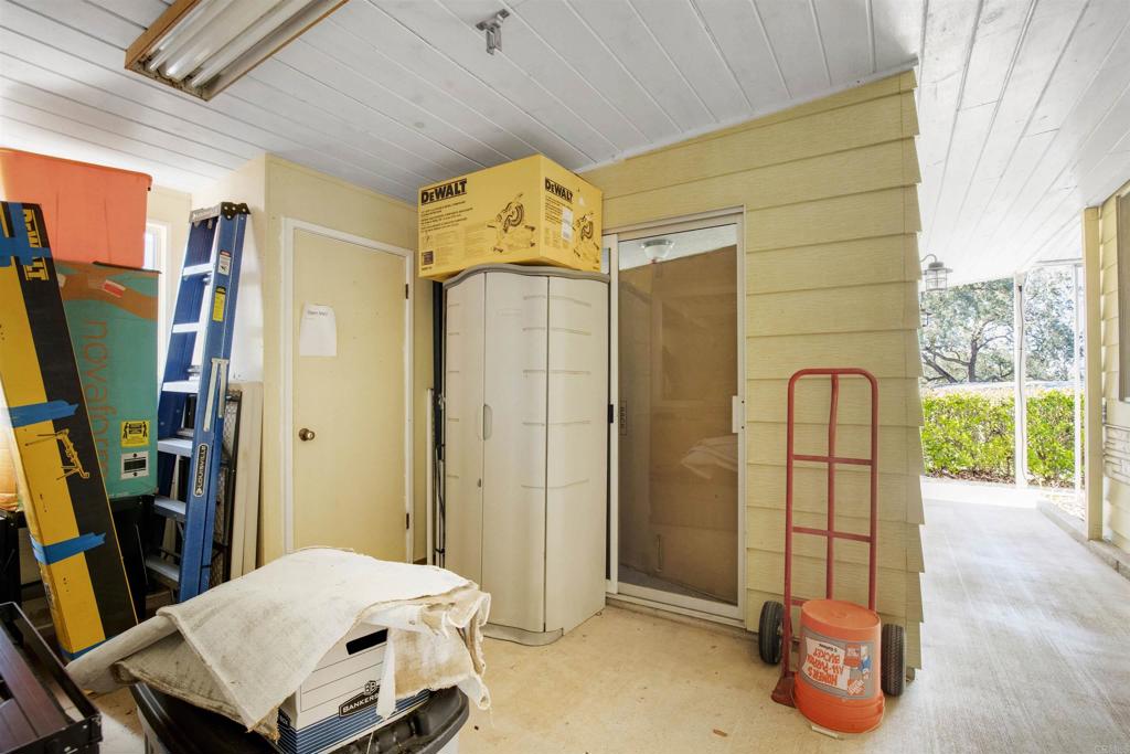 18218 Paradise Mountain Road Valley Center, CA 92082 - Photo 27 of 53 a living room with a couch and a table