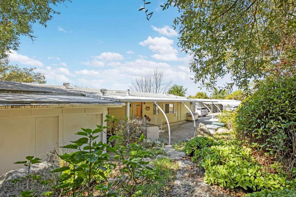 18218 Paradise Mountain Road Valley Center, CA 92082 - Photo 34 of 53 an aerial view of a house with garden space and sitting space