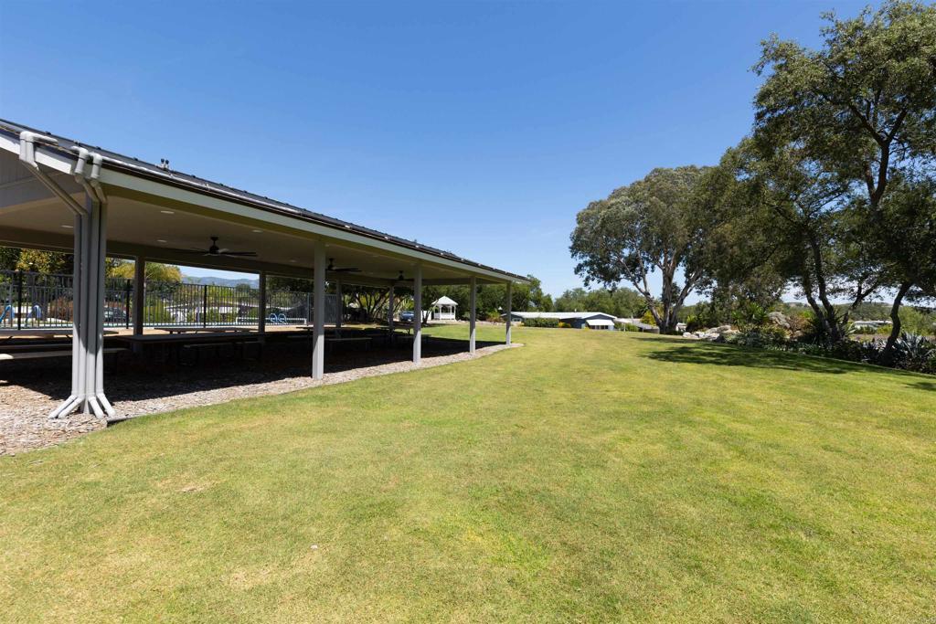 18218 Paradise Mountain Road Valley Center, CA 92082 - Photo 38 of 53 a view of swimming pool with outdoor seating and covered with trees