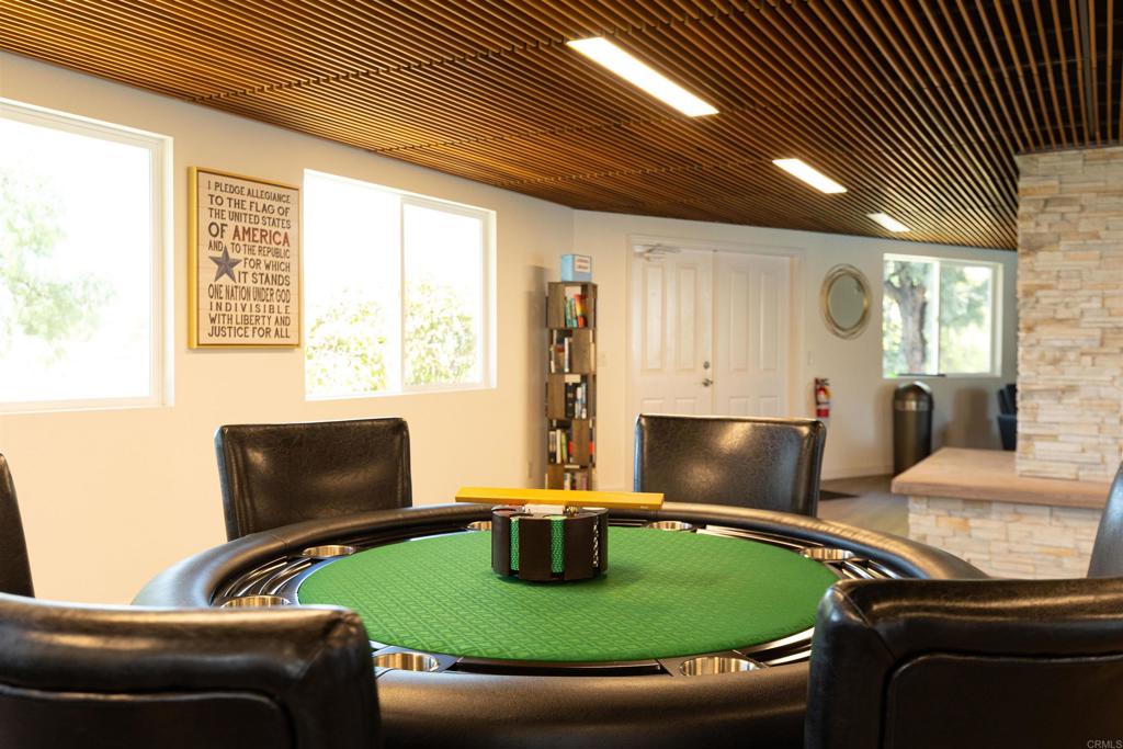 18218 Paradise Mountain Road Valley Center, CA 92082 - Photo 47 of 53 a living room with furniture and a flat screen tv