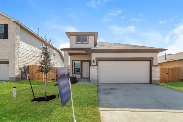 a view of backyard of a house