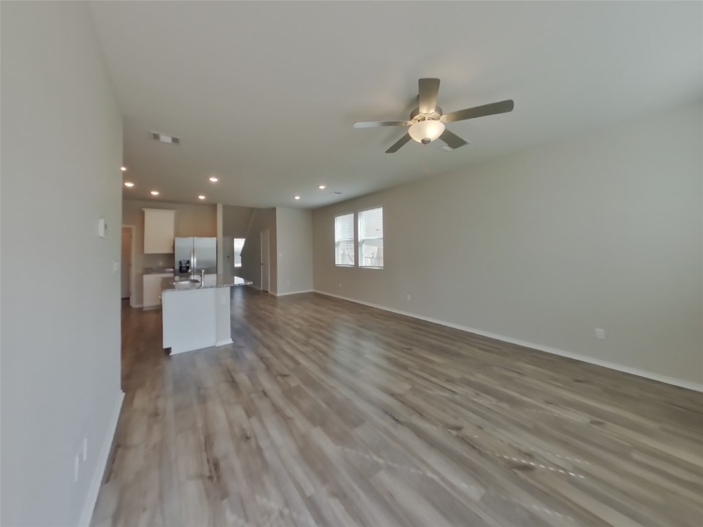 3504 Gooseneck Lane Georgetown, TX 78626 - Photo 2 of 27 a view of a kitchen with wooden floor and a kitchen