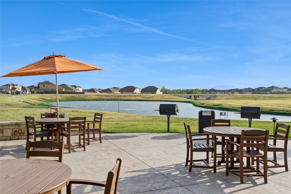 3504 Gooseneck Lane Georgetown, TX 78626 - Photo 22 of 27 an outdoor space with furniture and umbrella