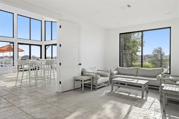 a living room with furniture and window