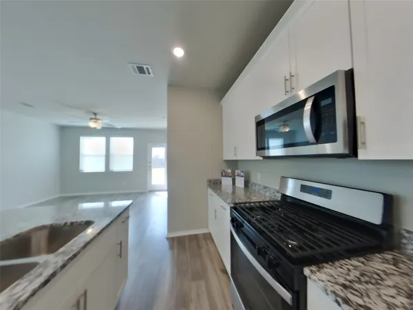 a kitchen with a stove and a microwave