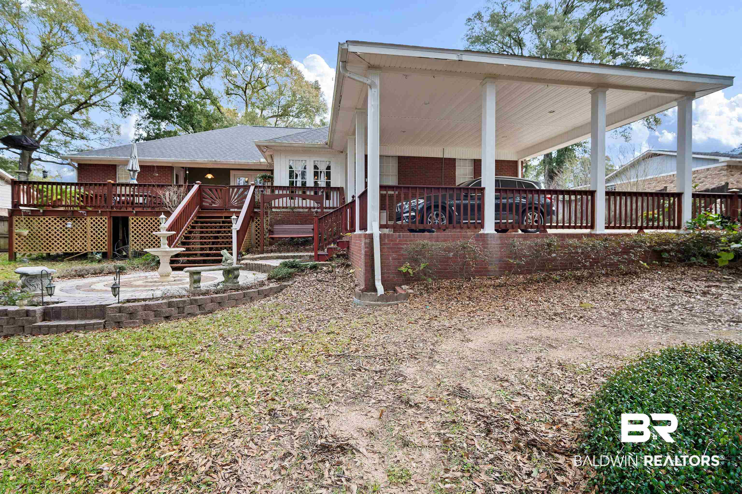 1744 Aden Road Mobile, AL 36695 - Photo 33 of 35 Rear view of house with a wooden deck