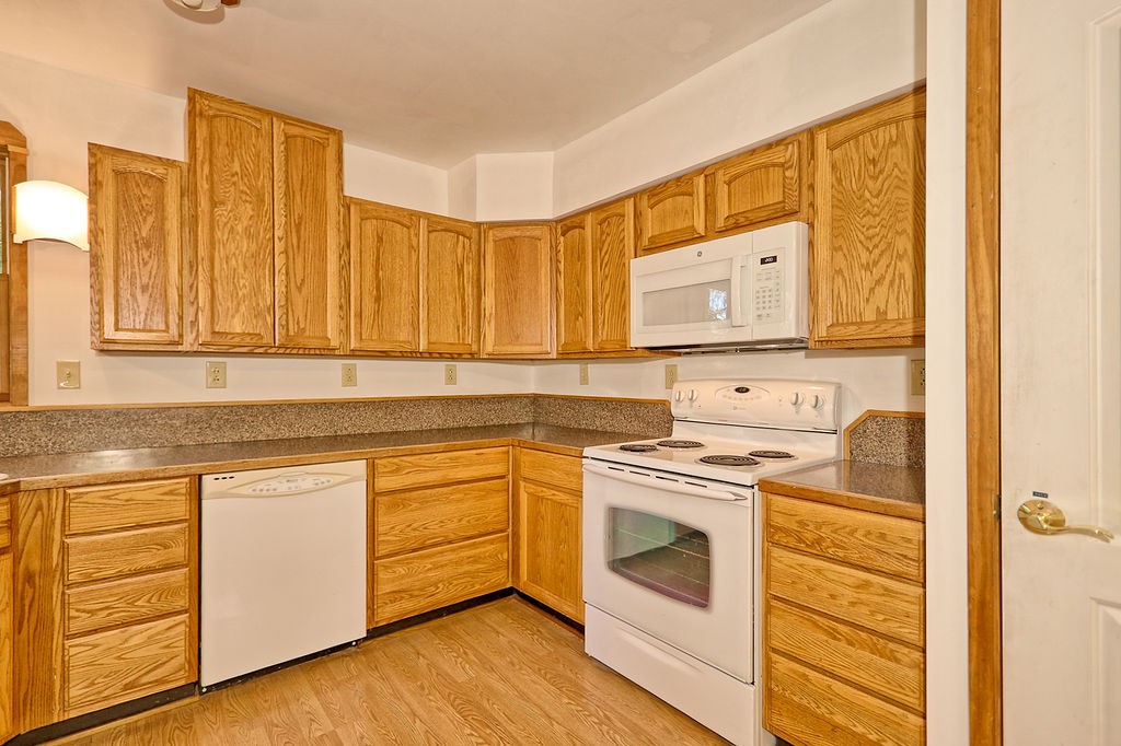 1053 Sam Johnson Road Columbia, TN 38401 - Photo 16 of 53 a kitchen with a stove top oven sink and cabinets