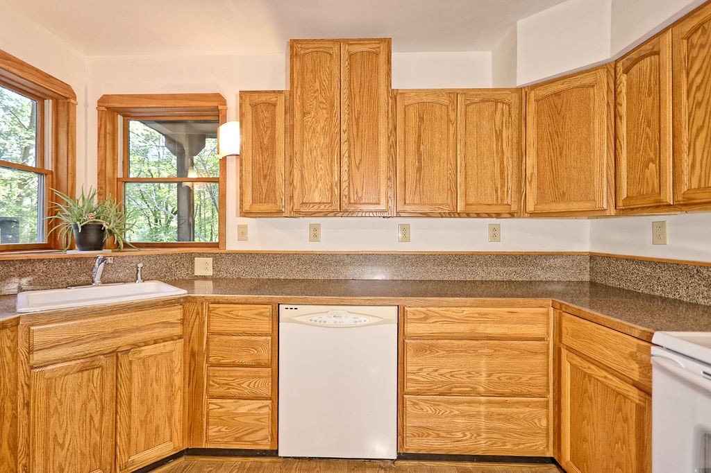 1053 Sam Johnson Road Columbia, TN 38401 - Photo 17 of 53 a view of a kitchen with a sink a window and cabinets