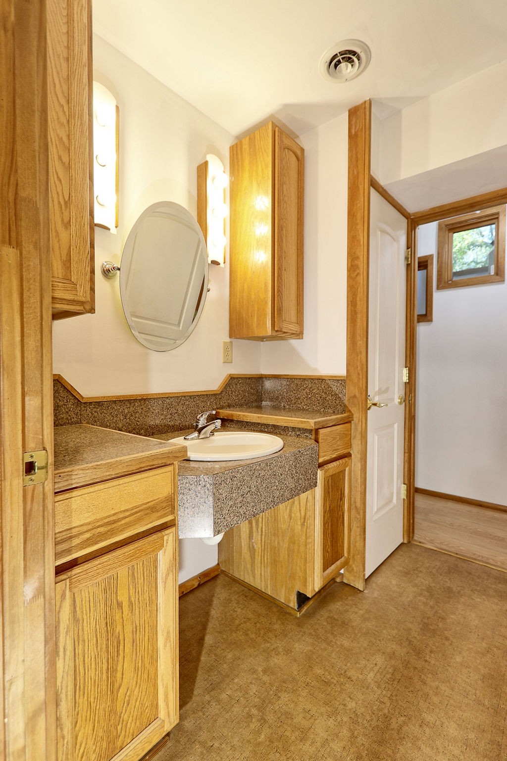 1053 Sam Johnson Road Columbia, TN 38401 - Photo 31 of 53 a bathroom with a granite countertop sink and a mirror