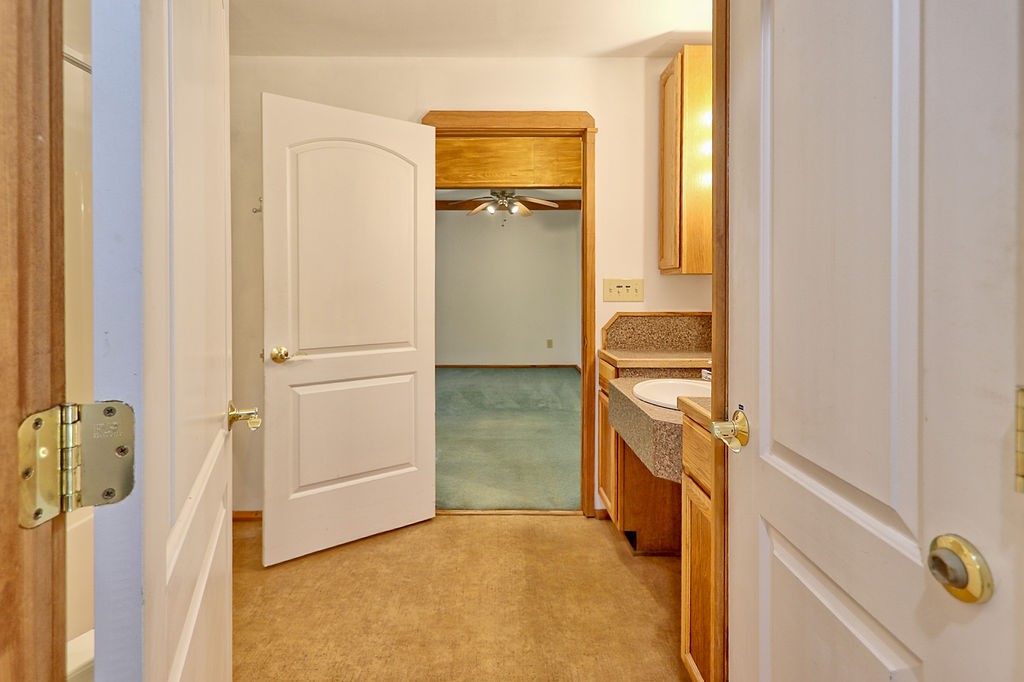 1053 Sam Johnson Road Columbia, TN 38401 - Photo 34 of 53 a bathroom with a tub sink and mirror