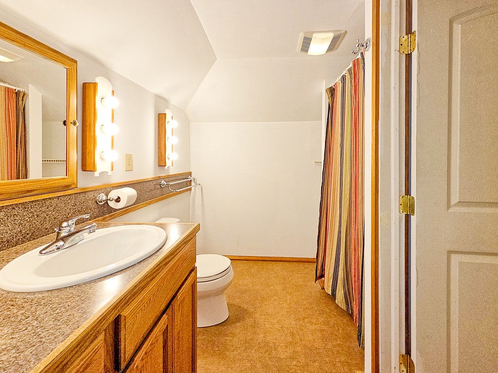 1053 Sam Johnson Road Columbia, TN 38401 - Photo 45 of 53 a bathroom with a granite countertop sink toilet and shower