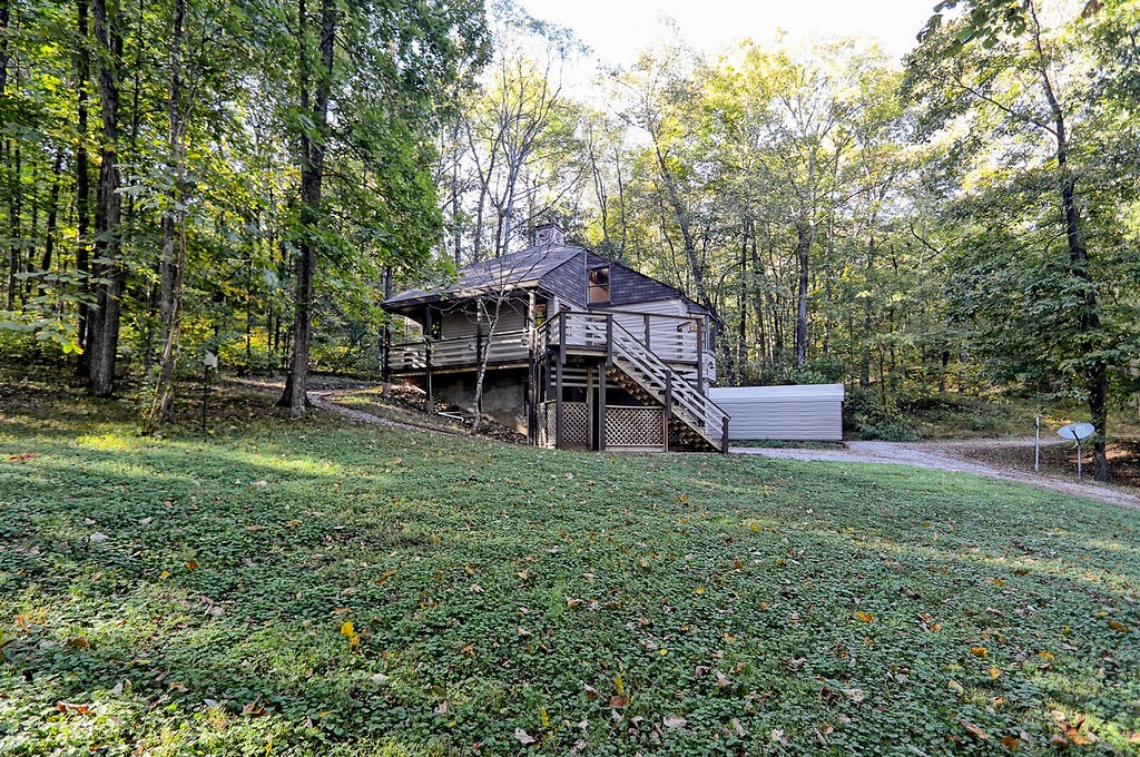 1053 Sam Johnson Road Columbia, TN 38401 - Photo 52 of 53 a backyard of a house with table and chairs