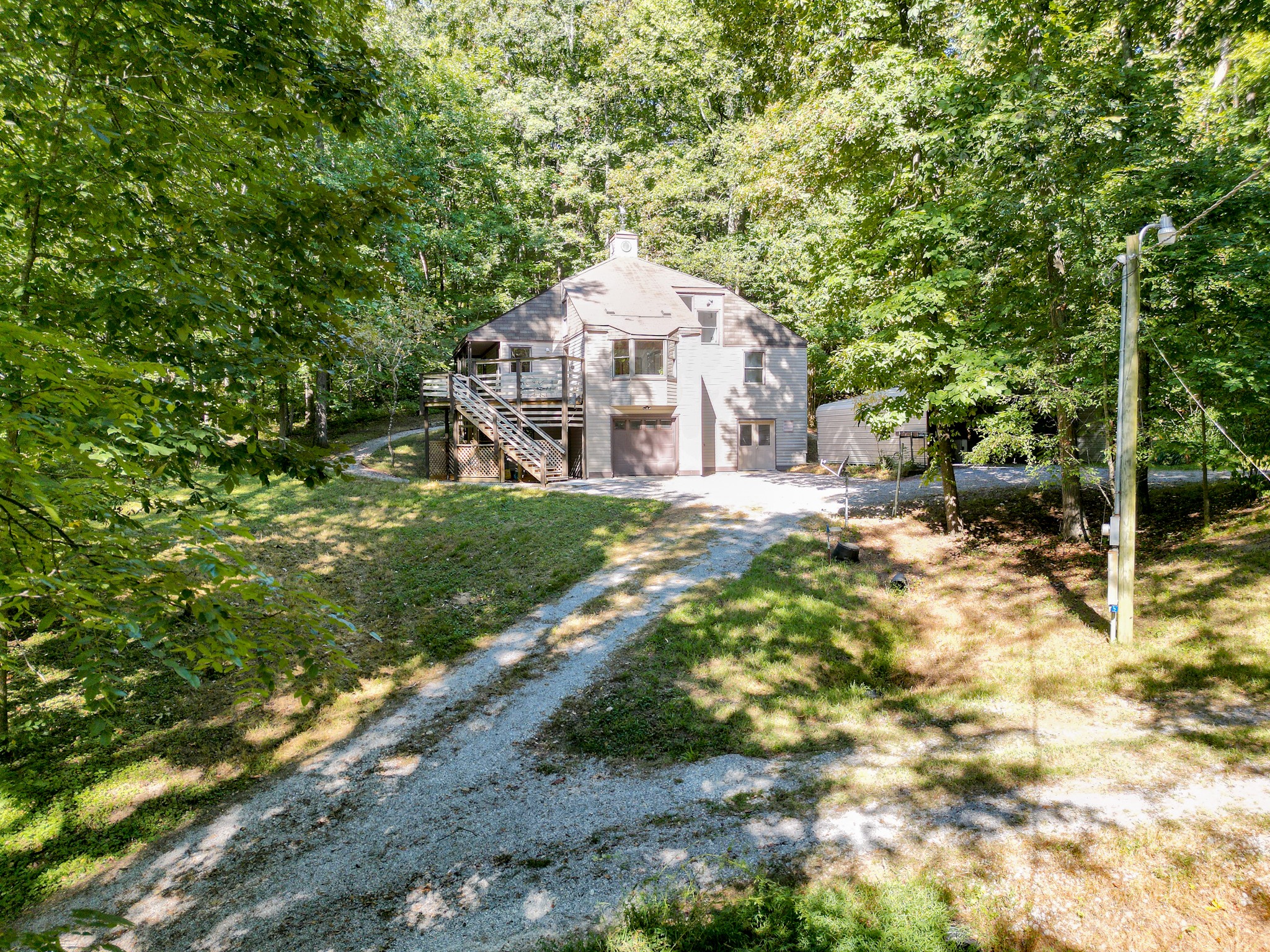 1053 Sam Johnson Road Columbia, TN 38401 - Photo 6 of 53 a dirt road with trees in front of it