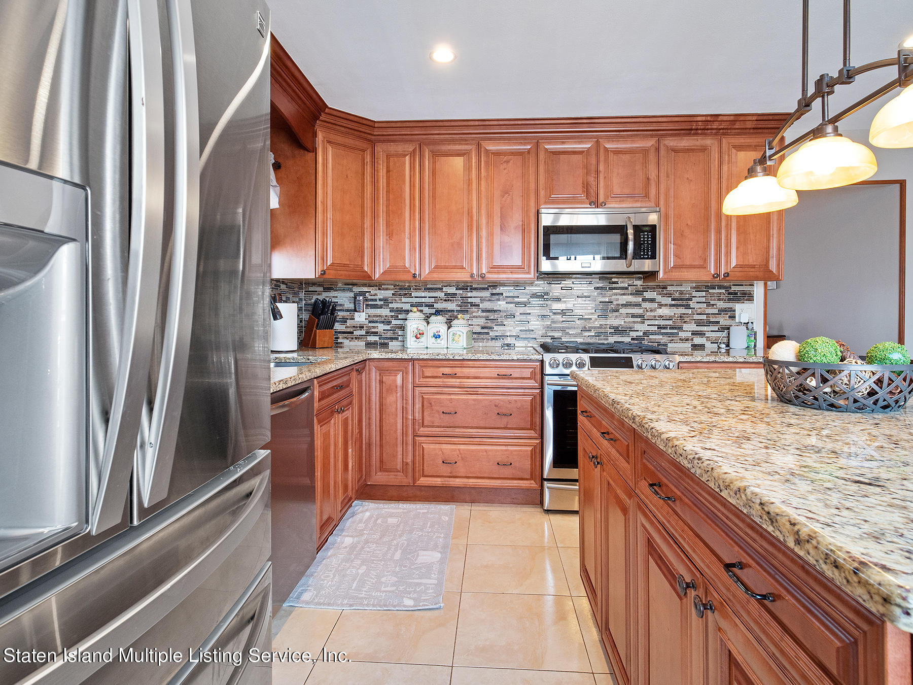 84 Stack Drive Staten Island, NY 10312 - Photo 13 of 29 a kitchen with stainless steel appliances granite countertop a refrigerator a stove and a sink