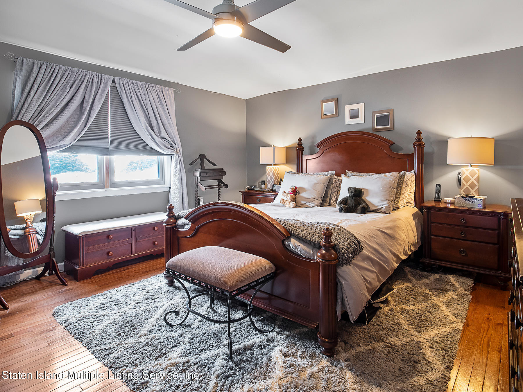 84 Stack Drive Staten Island, NY 10312 - Photo 15 of 29 a bedroom with a bed lamp and a dresser