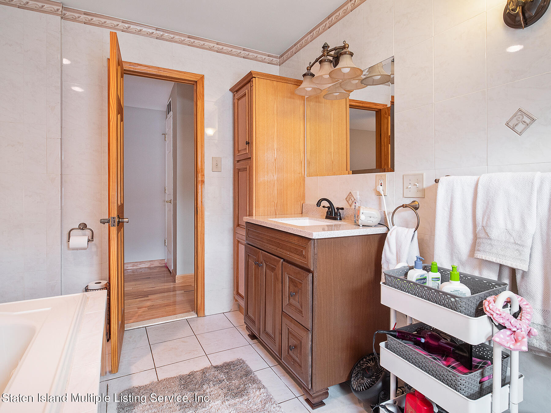 84 Stack Drive Staten Island, NY 10312 - Photo 19 of 29 a bedroom with a bed and a dresser