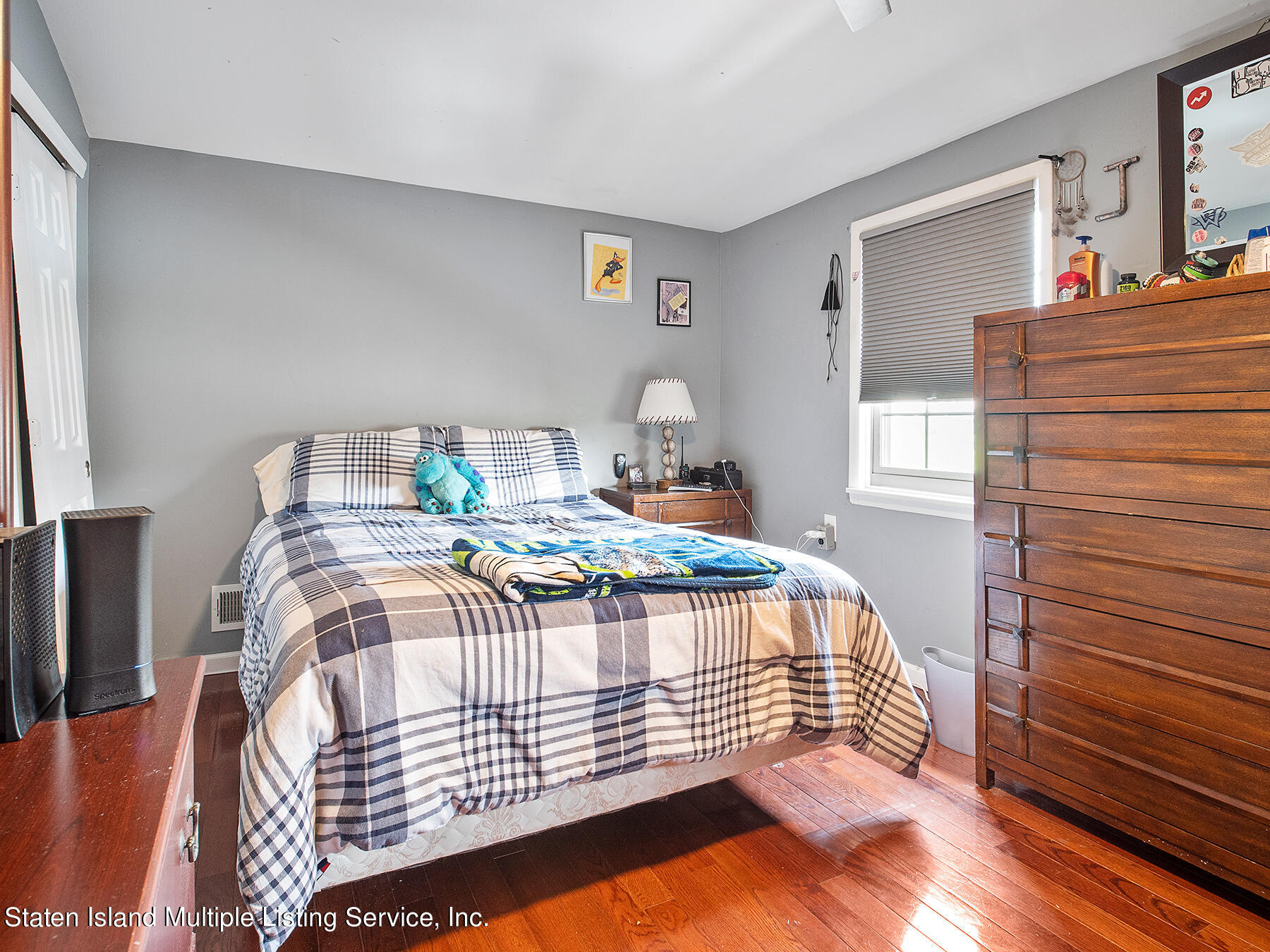 84 Stack Drive Staten Island, NY 10312 - Photo 21 of 29 a bedroom with a bed and a dresser