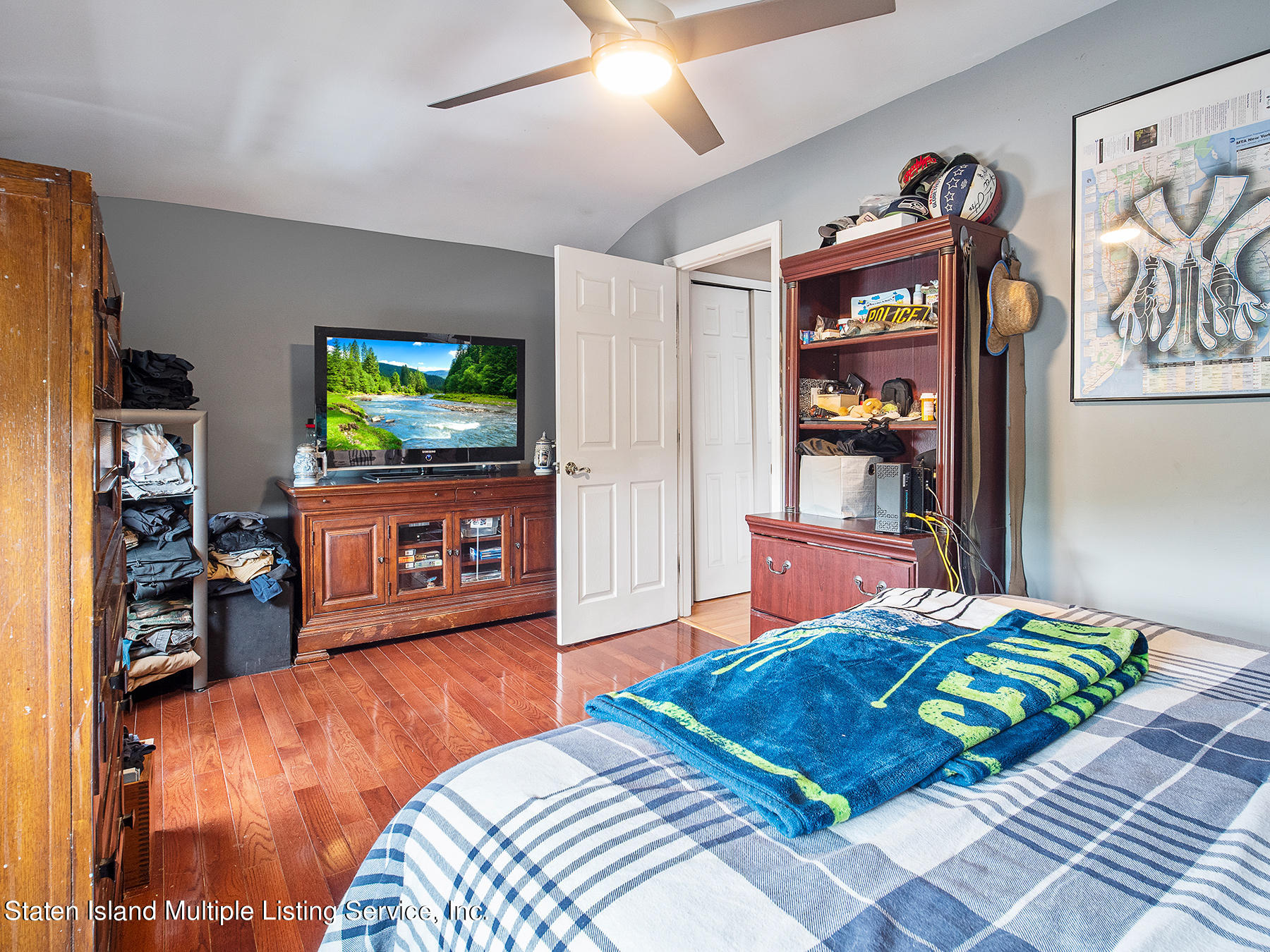 84 Stack Drive Staten Island, NY 10312 - Photo 22 of 29 a bedroom with bed and a flat screen tv
