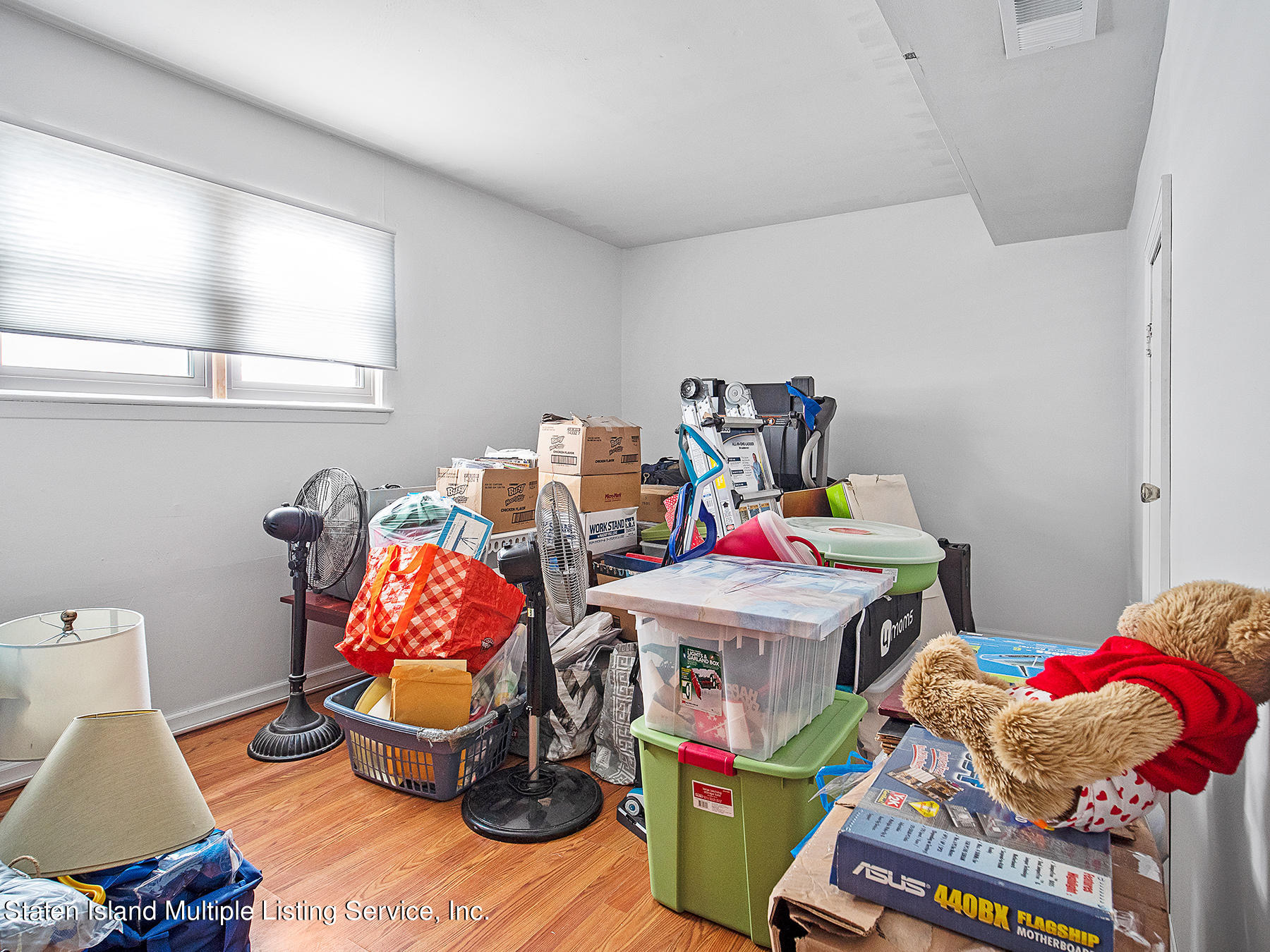 84 Stack Drive Staten Island, NY 10312 - Photo 23 of 29 a utility room with dryer and bicycles
