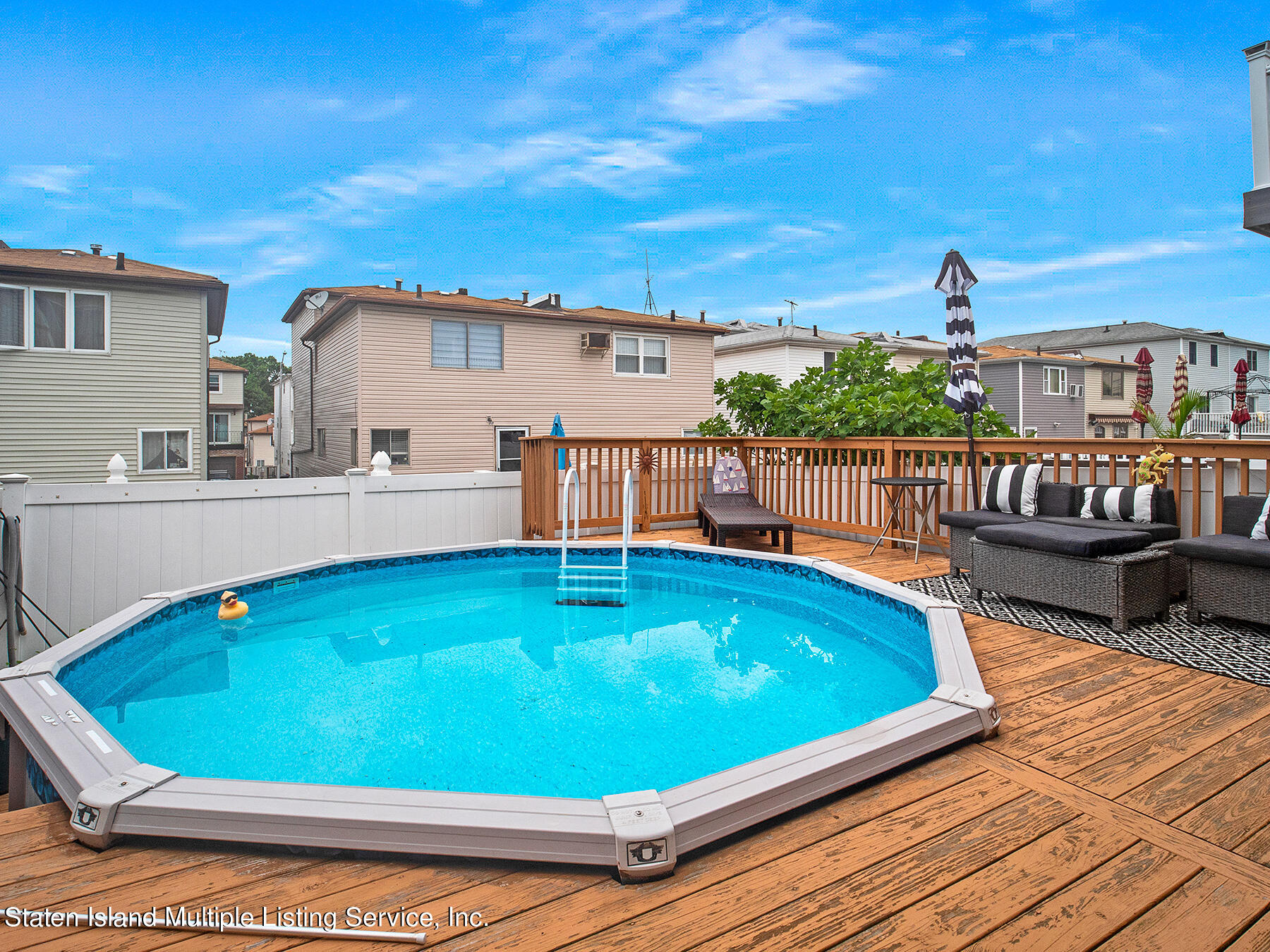 84 Stack Drive Staten Island, NY 10312 - Photo 28 of 29 a view of a swimming pool with a lounge chairs